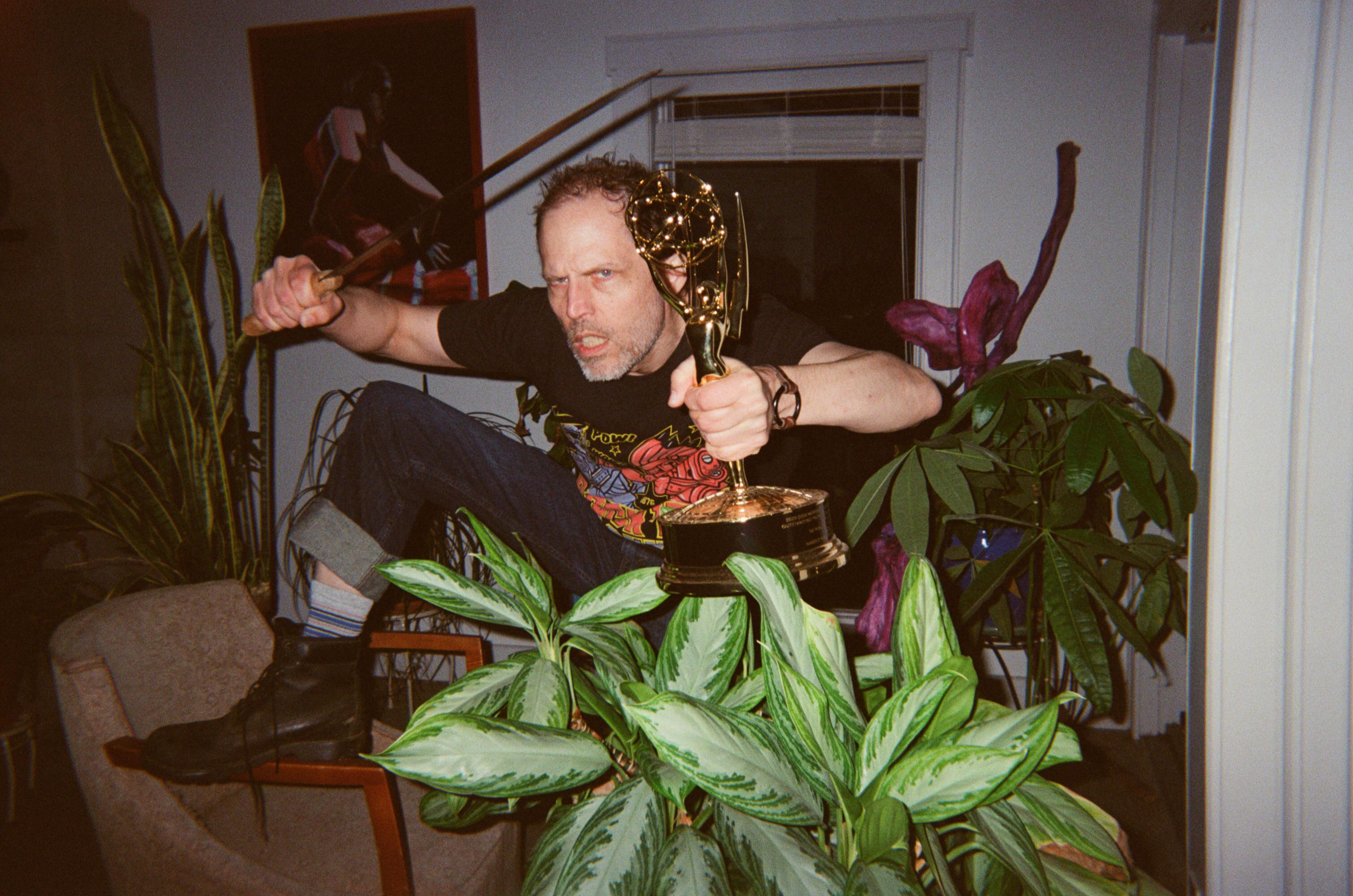 Portrait of Emmy winner with plants