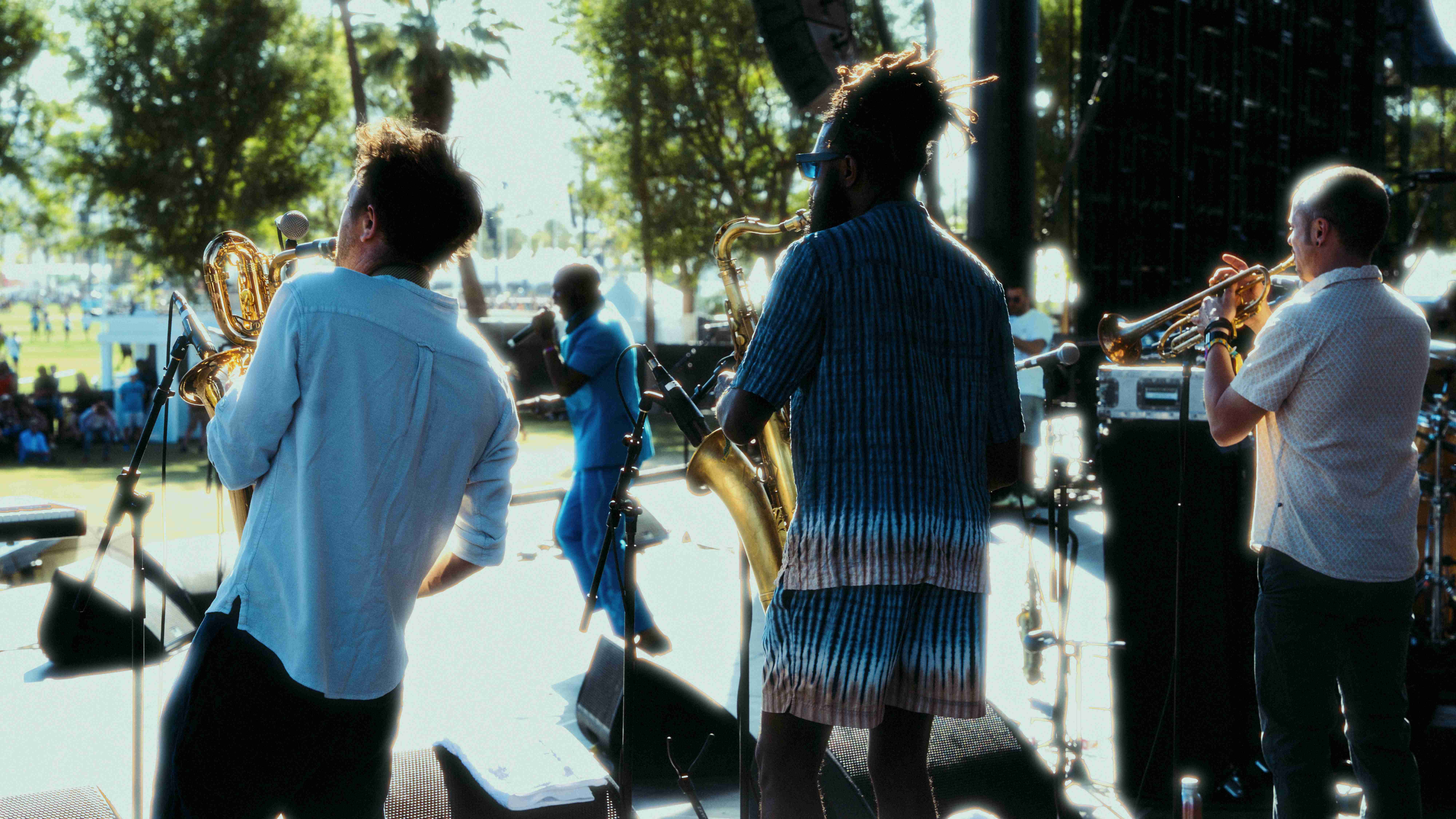 Backlit band performing on stage