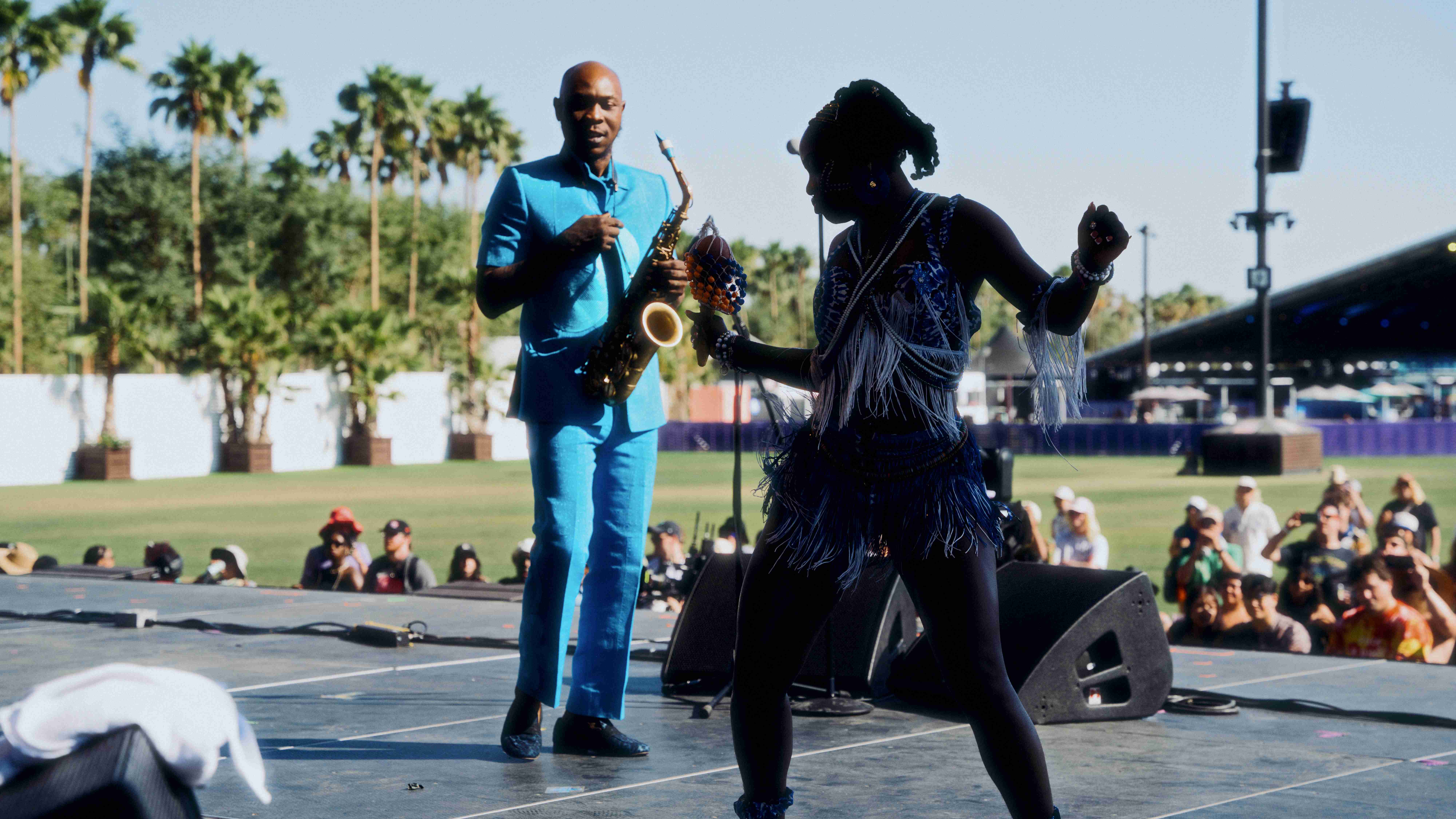 Saxophonist and dancer performing together